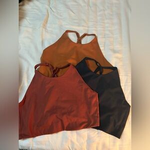 3 Girlfriend Collective Topanga Bras, Black, Trail, and Sedona